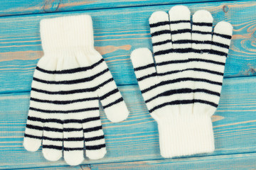 Black and white gloves for woman made of cotton or wool, clothing for autumn or winter concept