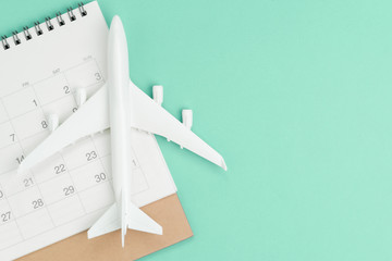 Travel schedule, plan for vacation or business trip date concept, white toy airplane on clean...