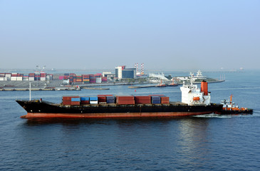 Cargo container ship arriving to the sea port in Kaohsiung, Taiwan.