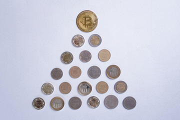 Pyramid of Colombian coins with a Bitcoin on top isolated in a white background