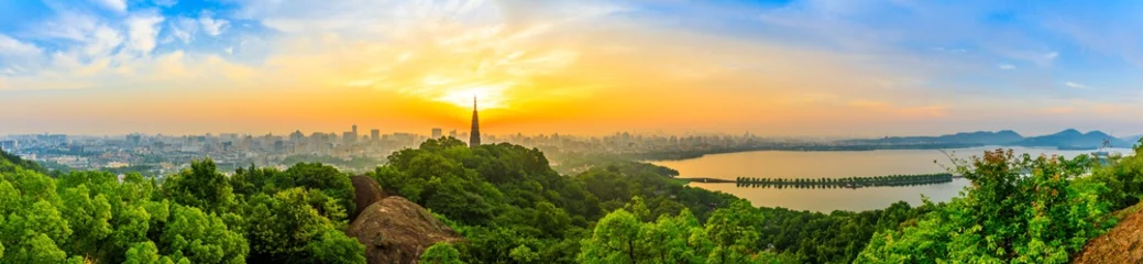 Fotobehang Panoramic city skyline and green mountains at sunrise in Hangzhou,China. © ABCDstock
