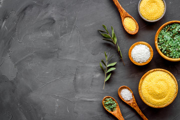 Mineral bath salt on grey background top-down frame copy space