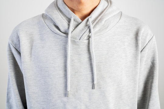 young person wear gray hoodie, sweatshirt mockup, isolated on white background.