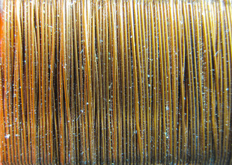 Background of copper wire wound on a coil. A close-up shot of the wire.