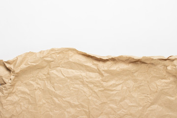 Edge of crumpled craft paper. Texture, banner. Can be used as background. Top view, flat lay