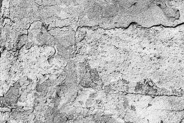 Texture of a concrete wall with cracks and scratches which can be used as a background