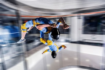 Force. Skydiver conquers the world. Skydiving team use professional equipment. Extreme sport for young men.