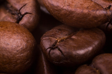macro background of brown roasted coffee beans