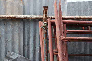 close up on scaffolding on metal sheet wall