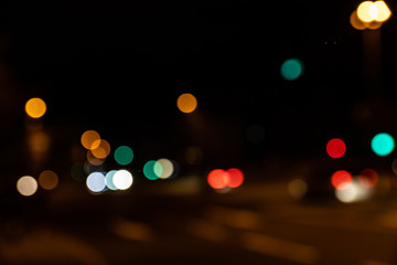 Blurred city lights of an intersection at night