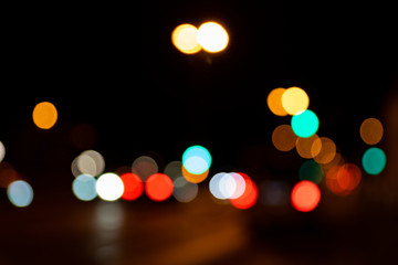 Blurred city lights of an intersection at night