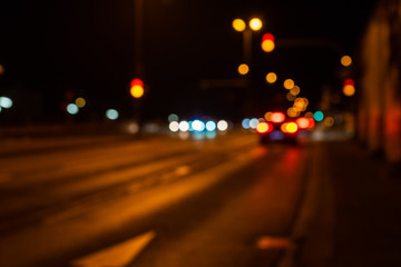 Blurred city lights of an intersection at night