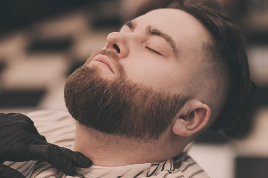 Man With Beard In Barber Shop. Modern Hair Salo