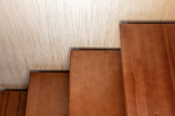 Fragment of a wooden interior staircase in a private house.