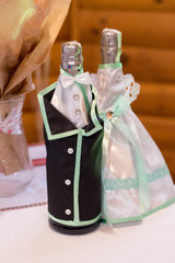 Champagne decorated in a wedding style on the table