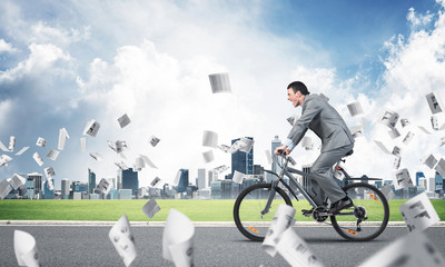 Accountant wearing business suit riding bicycle