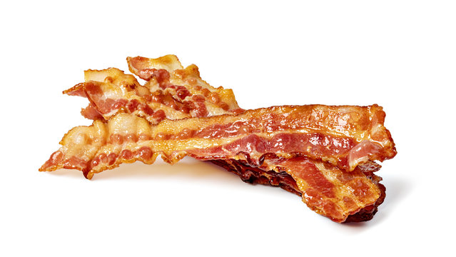 Closeup of slices of crispy hot fried bacon