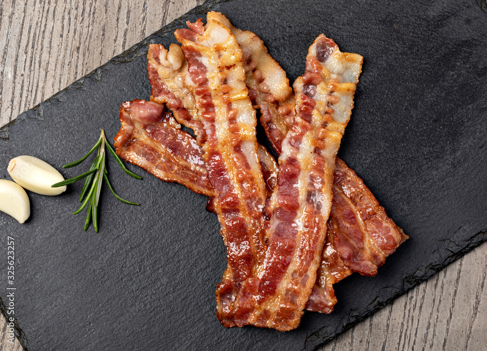 Canvas Prints Closeup of slices of crispy hot fried bacon