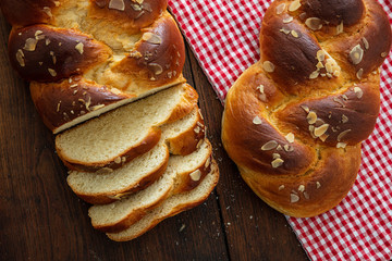 Easter greek tsoureki braid, sweet bread brioche on wood