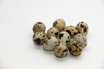 Obraz premium quail eggs on white background