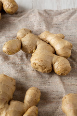 Raw Organic Ginger Root on cloth, low angle view. Close-up.