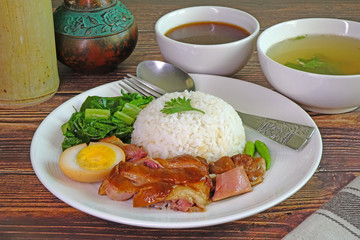 Stewed pork leg with rice, famous Thai - Chinese cuisine. Selective focus.