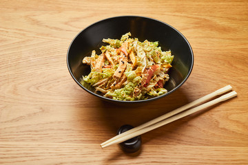 Chicken salad with vegetables and mixed greens flavored sesame seeds. Delicious healthy eating.