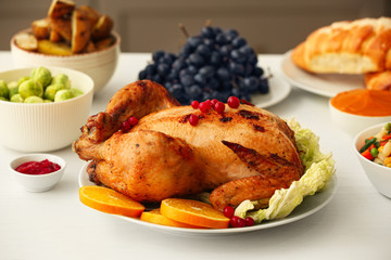 Tasty baked turkey for Thanksgiving day on table