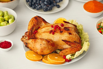 Tasty baked turkey for Thanksgiving day on table