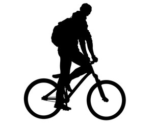 Fototapeta premium Young athlete on a bike for extreme stunts. Isolated silhouette on a white background