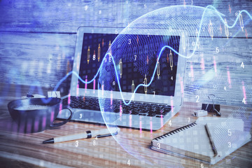 Multi exposure of chart and financial info and work space with computer background. Concept of...