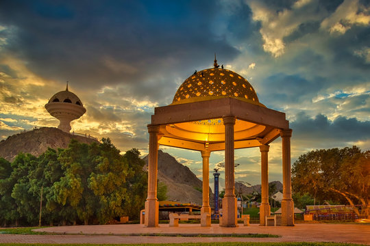 Gazebo Dome bathed in Golden light along with the Frankincense burner monument in the evening. From Muscat, Oman.