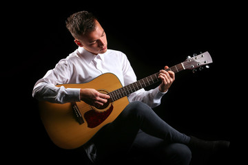 Young men playing the guitar