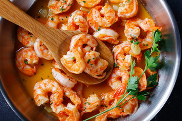 Italian shrimp scampi on a skillet, close-up - Powered by Adobe