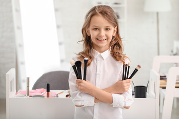 Cute little makeup artist at home