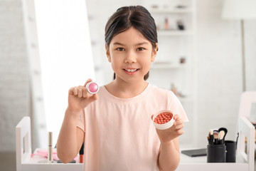 Cute little makeup artist at home