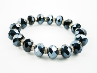 Woman bracelet made of stones on white background