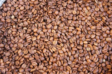 Raw coffee beans in sacks, coffee shop in Athens, Greece.