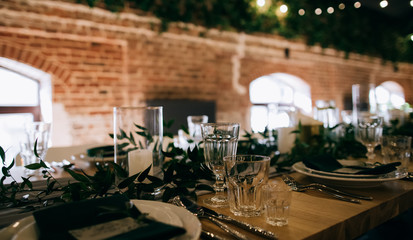 Rustic wedding table decor for restaurant dinner. Table set