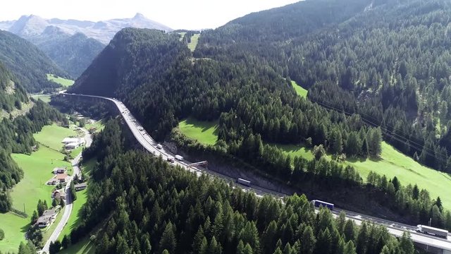 Aerial birds eye view of Brenner Pass in German language Brennerpass is mountain road through Alps which forms border between Italy and Austria it is one of principal passes of Eastern Alpine range 4k