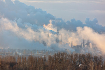 Fototapeta na wymiar Smoke from the factory at dawn