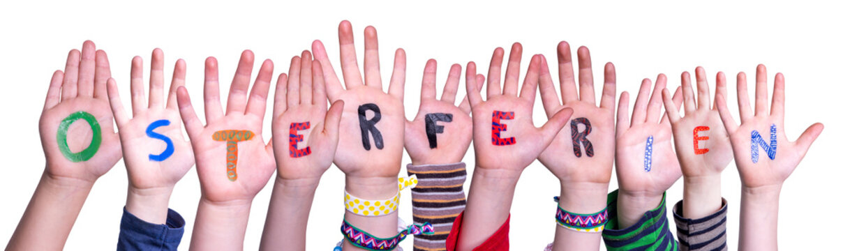 Children Hands Building Colorful German Word Osterferien Means Easter Break. Isolated White Background