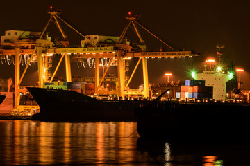 Cargo ship loading goods at shipping port at bangkok ,Thailand