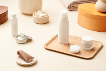 Fototapeta na wymiar Set of skincare cosmetics on beige table