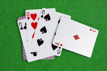 Several playing cards face-up on the rest deck cards