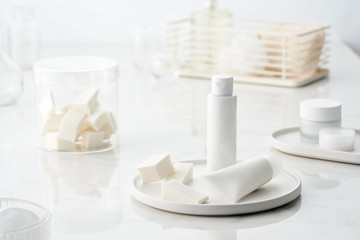 Set of cosmetic products in white packages