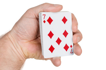 Deck of playing cards in male hand on white background