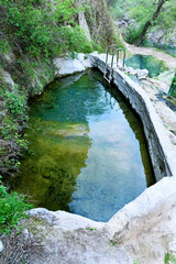Fototapeta na wymiar Bath with mineral water in Vrotan River Gorge, Devil's Bridge, Satan's Bridge, Armenia