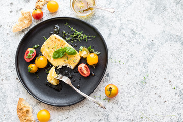 Pan-fried salty feta cheese coated in breadcrumbs