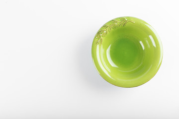 Empty green saucer on a white background
